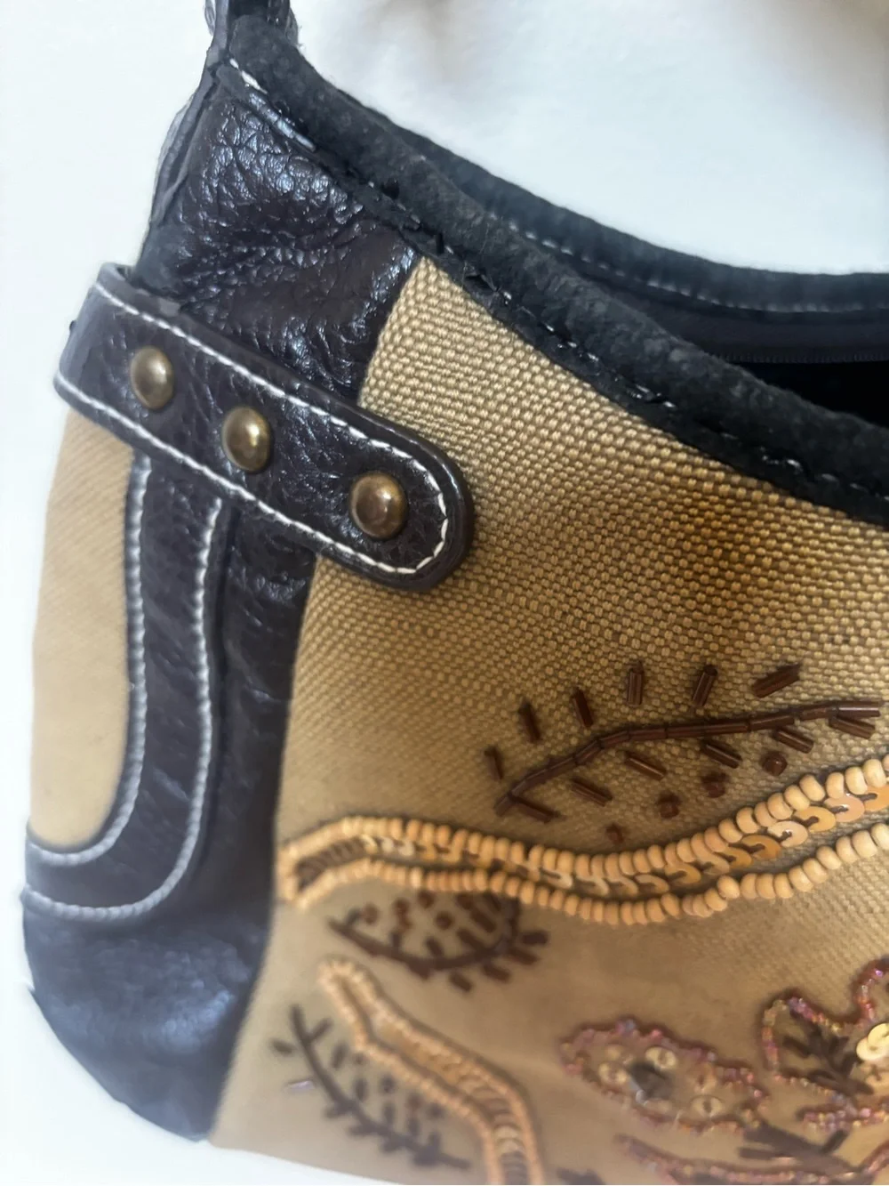 tan canvas and black pebbled leather accented with metallic studs VTG